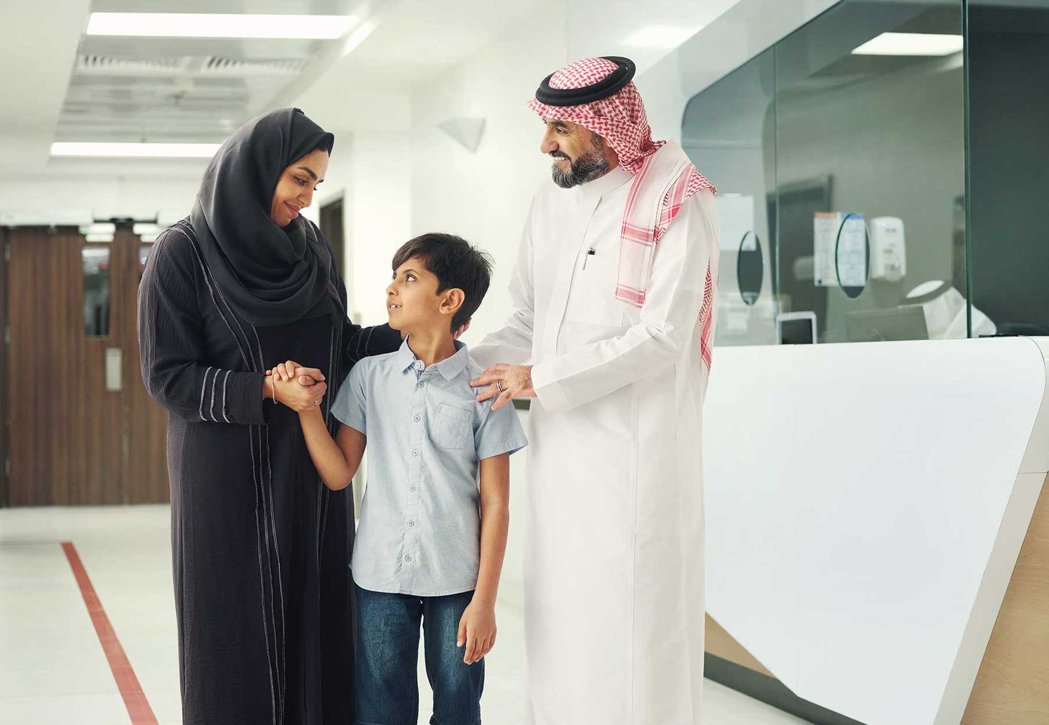 Middle‑eastern family smiling together, representing Bupa Family health insurance